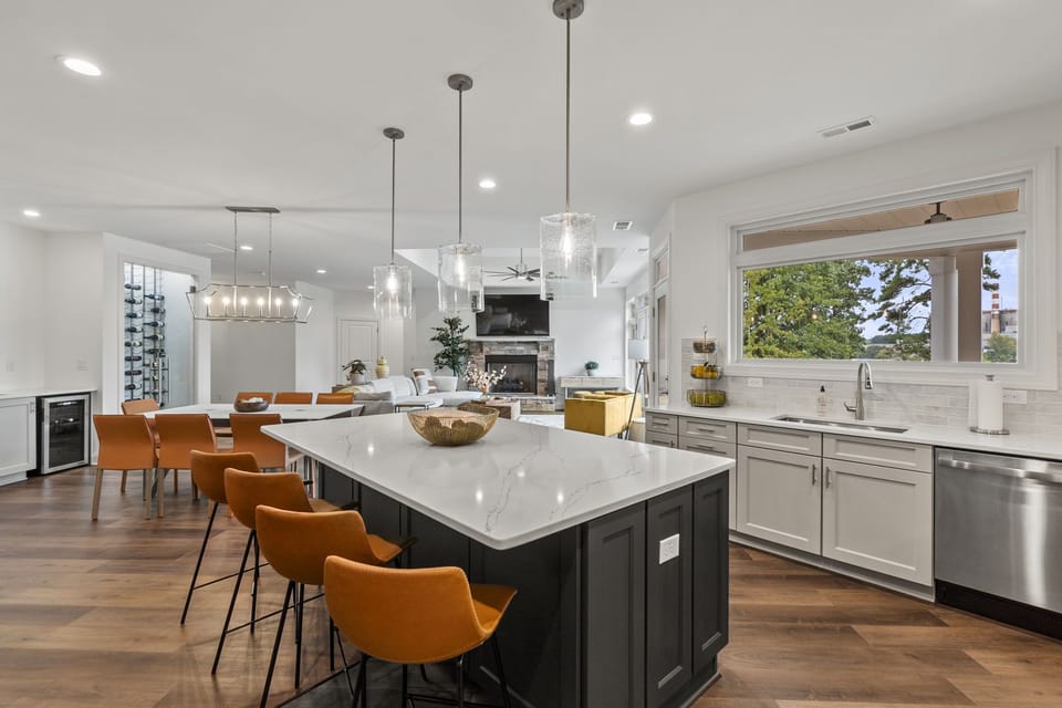 Room for 4 at the kitchen island counter, plus two additional bar stools for more seating as needed.