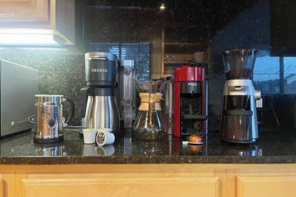 A coffee lovers dream! Keurig drip coffee, Nespresso, pour over, and coffee grinder available for our guests.