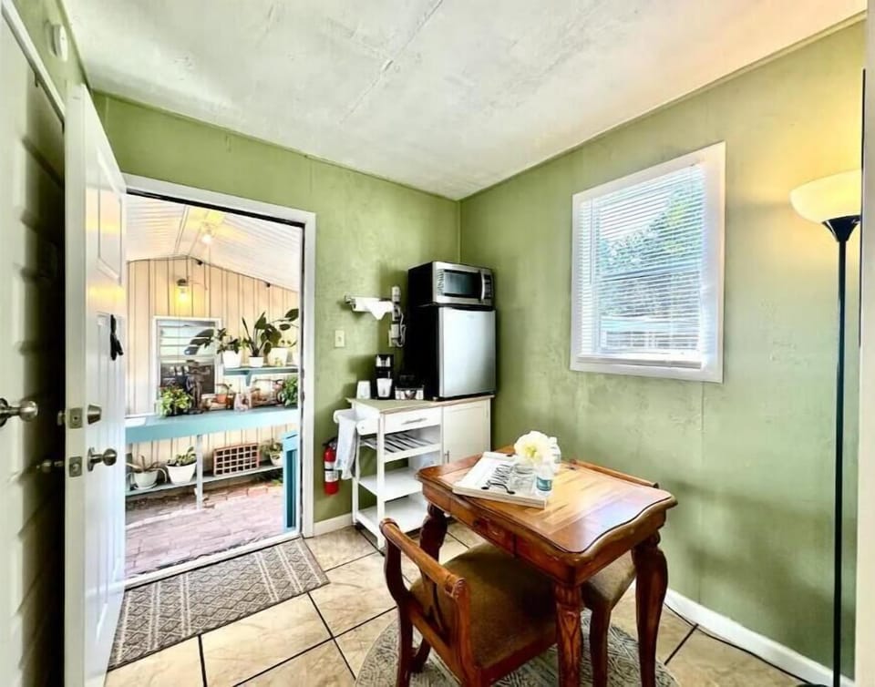 Mini fridge/freezer with ice trays and microwave provided.