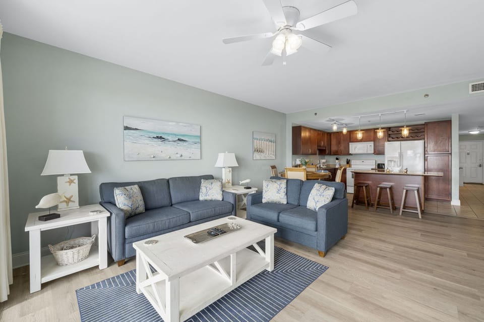 Living Area with Ocean Views, Flat Screen TV, and Private Balcony Access