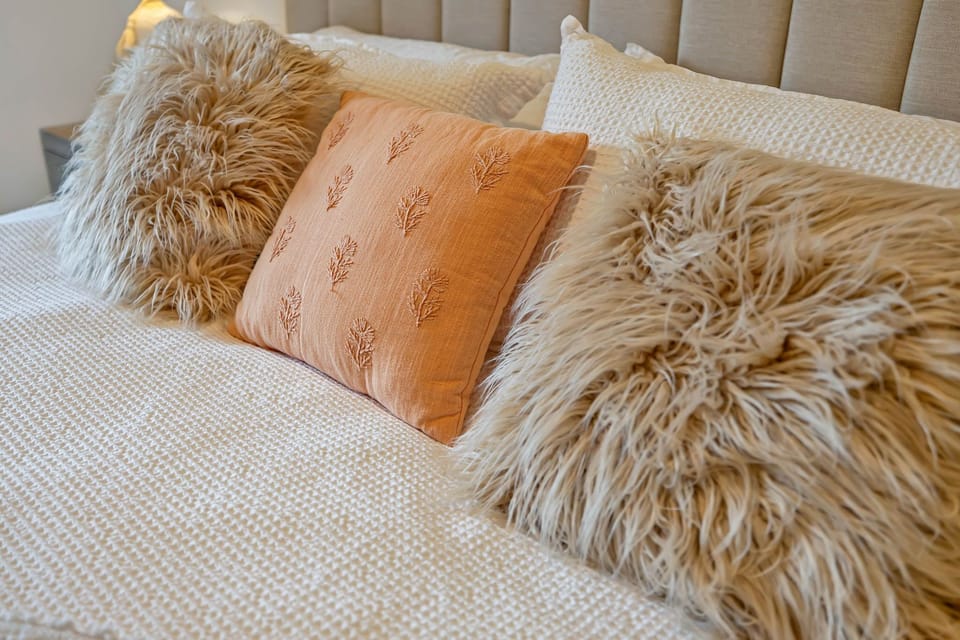 2nd Bedroom with King bed, smart TV, and floor-to-ceiling windows.