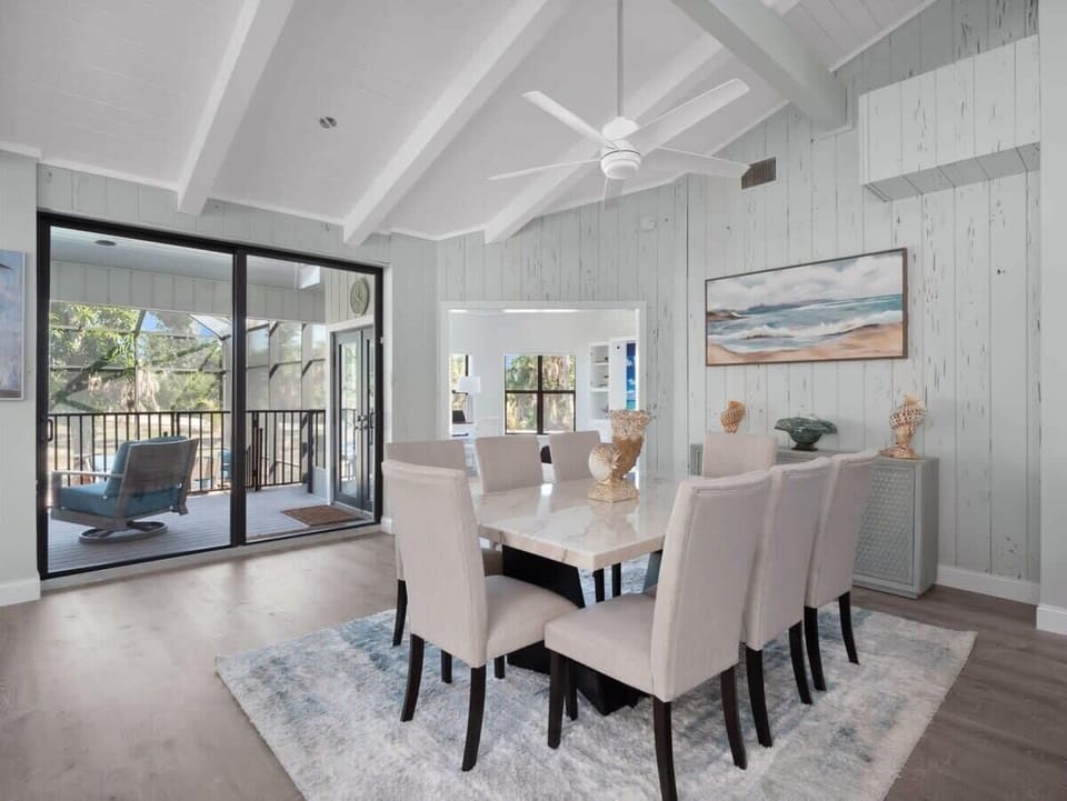 Dining service for up to eight guests at dining table and an additional three at breakfast bar