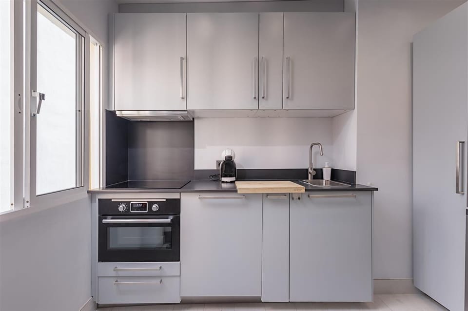 Modern kitchen in this apartment is very well fitted 