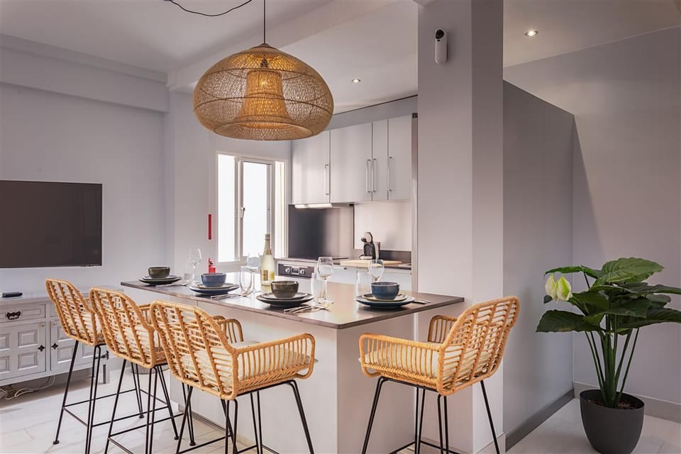 Modern dining area for four guests next to the open kitchen