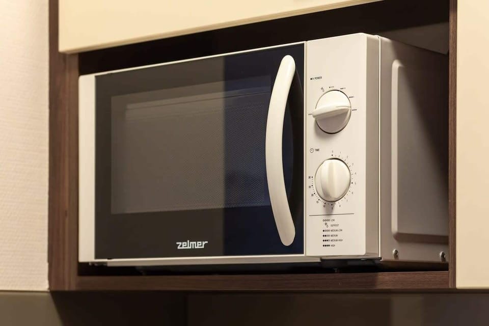 The kitchenette's practical layout maximizes space and functionality.