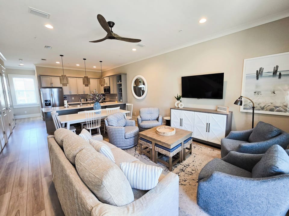 The spacious living room offers the comforts of home with plush furnishings and a Smart TV equipped with cable and streaming options