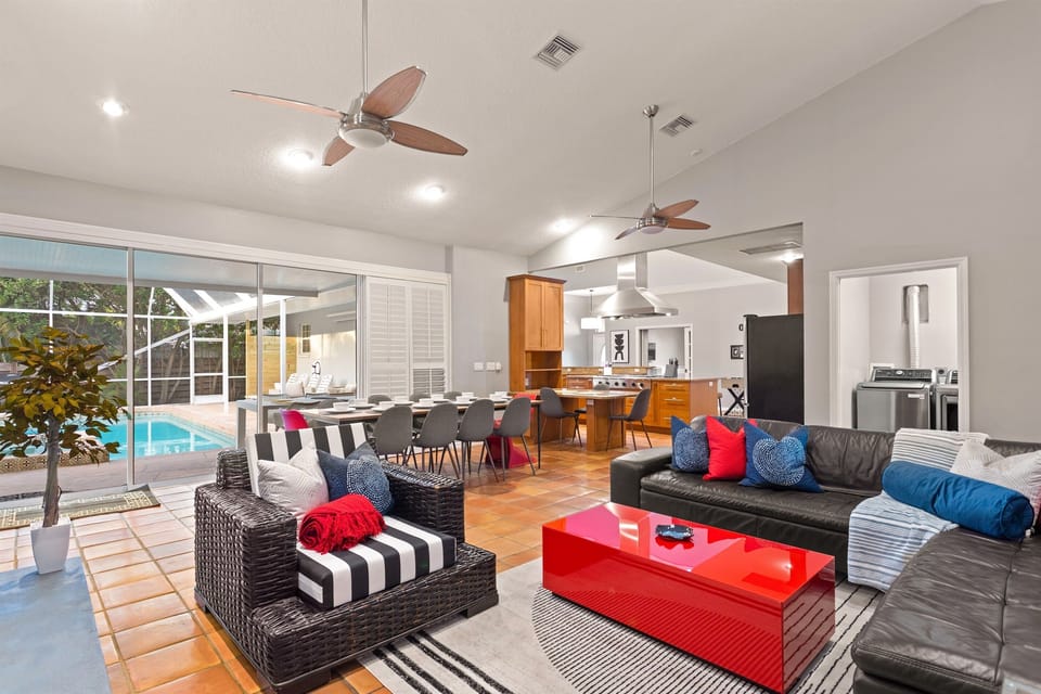 Welcome to Champion Retreat! Gather in this bright open space where the kitchen, dining, and lounge flow seamlessly to the pool, perfect for relaxed mornings and sunset swims.