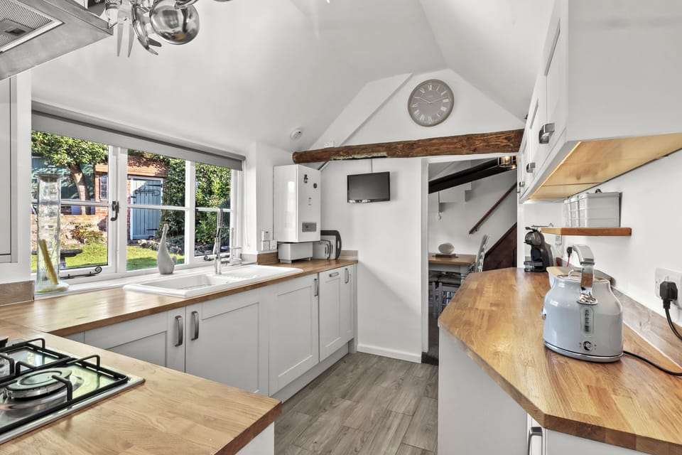 The Kitchen links directly with the Dining Room...