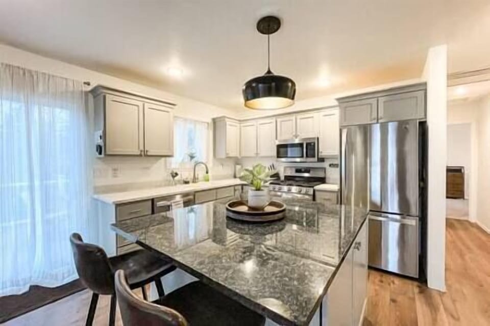 Zoomed in view of the kitchen and island. 