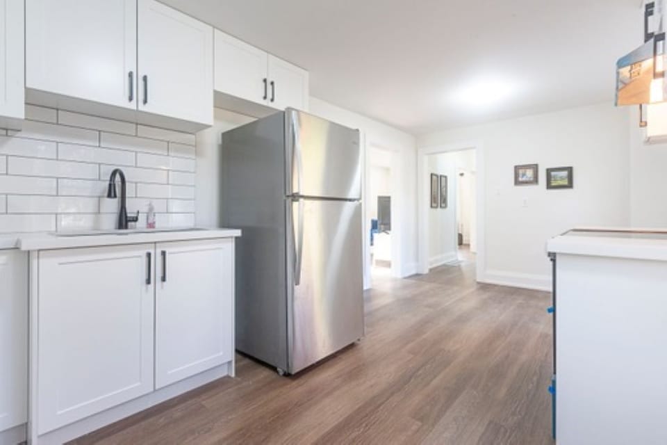 Full kitchen with stove, refrigerator, microwave 