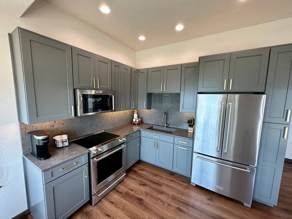 There is no shortage of space with the plentiful kitchen cabinets. The full sized refrigerator, oven, stove and microwave make cooking a joy.