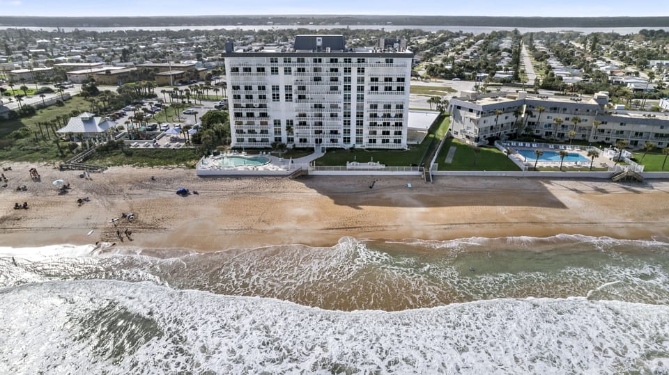The 9th floor unit is located in the Aquarius Oceanfront Condominium building.