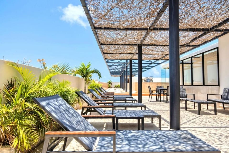 Sunny rooftop with pools & chill areas to relax all day