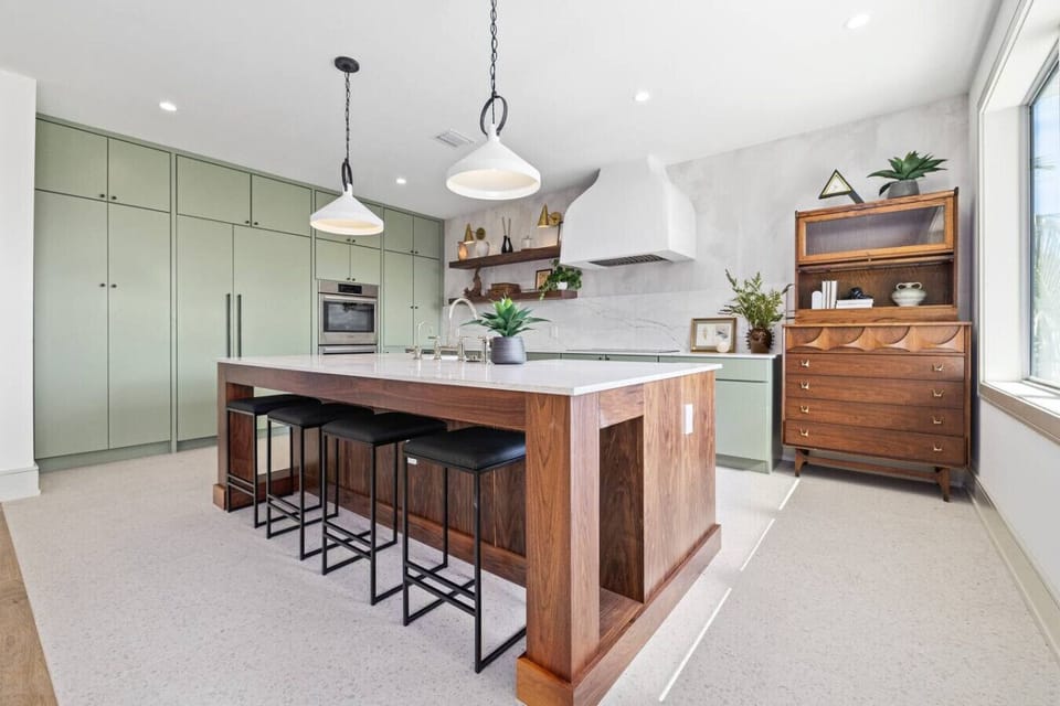 fully stocked, modern kitchen w/ breakfast bar