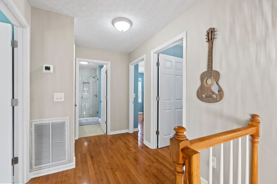 Top of staircase landing vantage point… Grand King Master on left, Queen Master and a bunk bed room on right. 