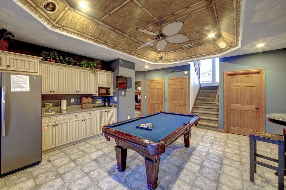 Rec room fun with the pool table and kitchenette on lower level festive & fun