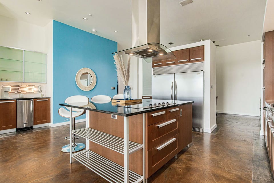 Whip up culinary delights in a kitchen that boasts an electric stove, a massive fridge, and a Keurig coffee maker and a traditional drip coffee maker for your morning brew.
