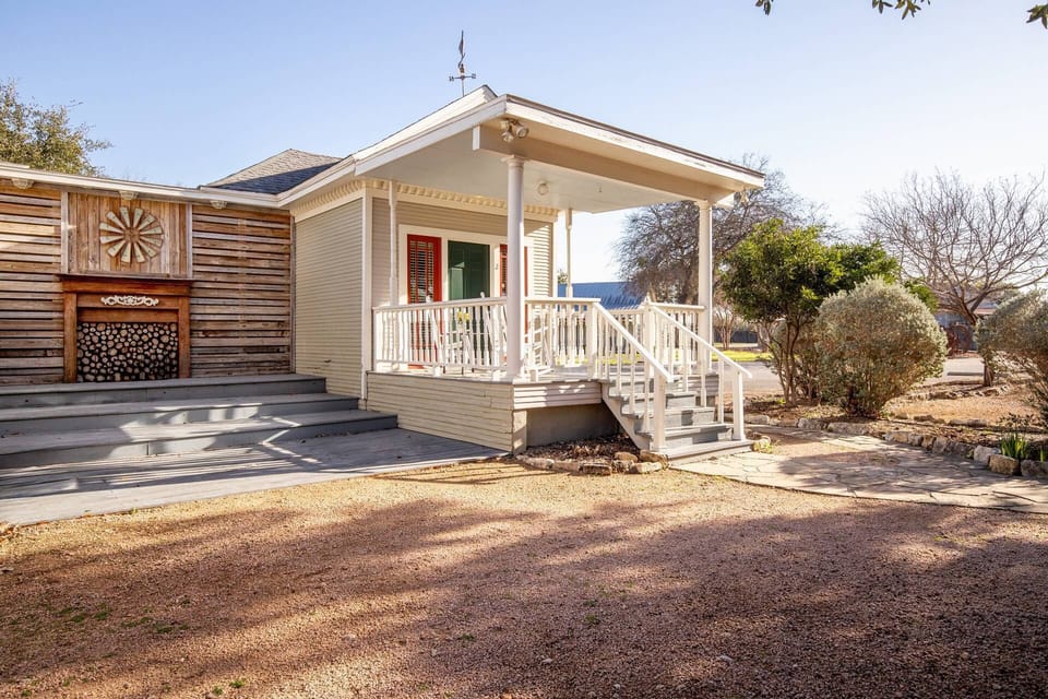 Embrace the beauty of a new day unfolding right from your front porch at The Cottage at Garrison in Gruene.