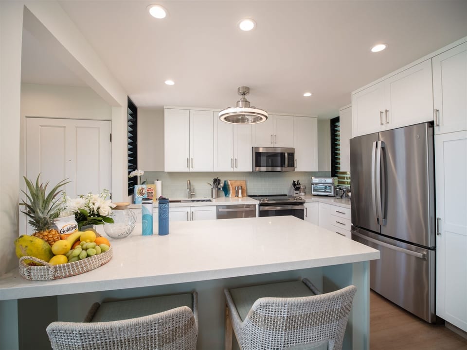 Newly remodeled kitchen and dining for four with bar seating for two and...