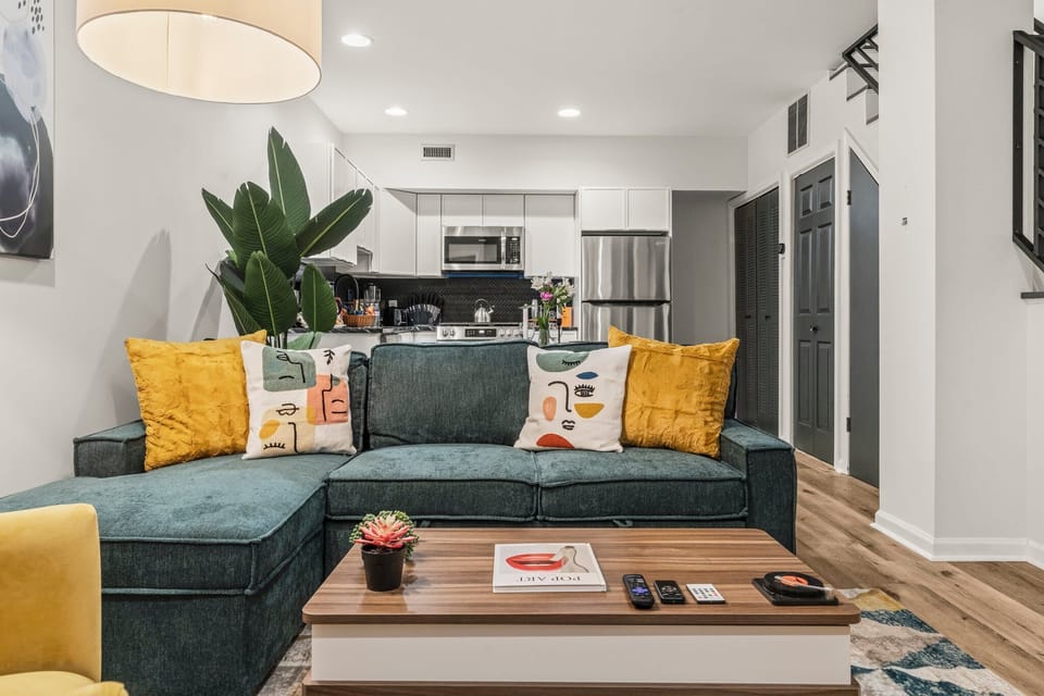 Sleek and spacious with bold pops of color — perfect for entertaining or simply relaxing in style.