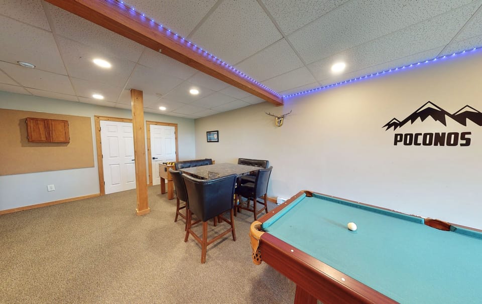 Game table, foosball, electronic darts, pub-size pool table, smart TV