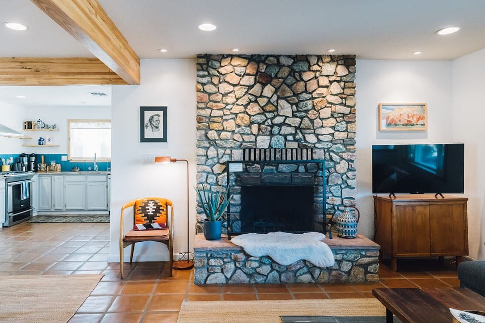 Whether you're looking to relax after a long day hiking or entertain friends and family, this living room has everything you need. Enjoy the comfortable L-couch seating, fireplace, and TV with Netflix and all the other streaming services through Roku.