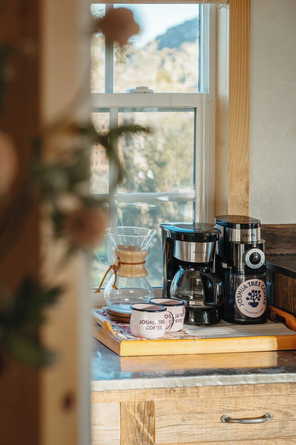 Sunlit coffee bar with grinder, drip & pour-over for perfect mornings
