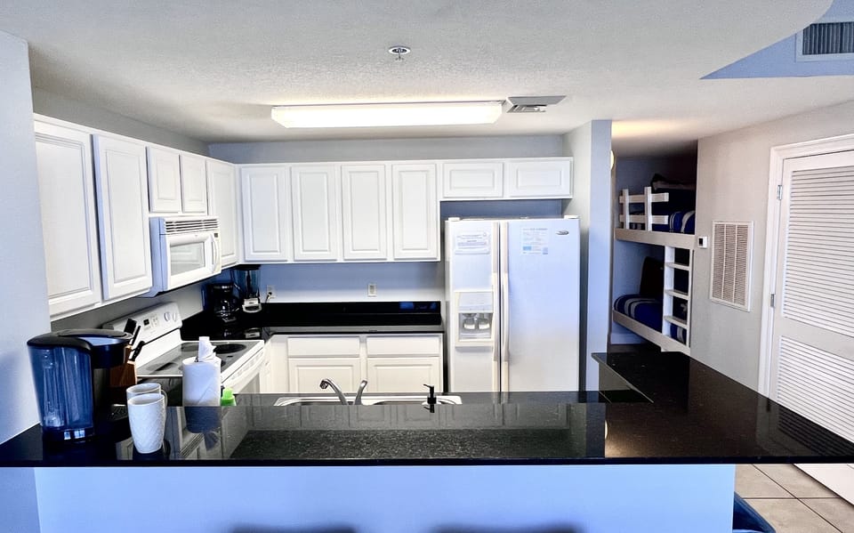 Fully Stocked Kitchen with Plenty of Storage Space