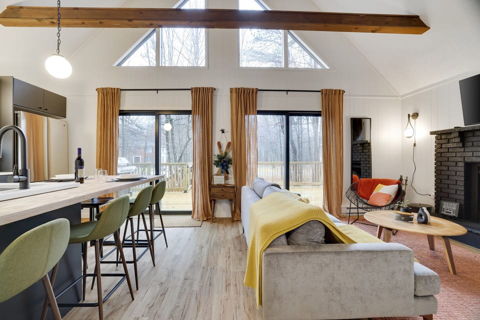 Grab a drink and get cozy with real wood fireplace under vaulted ceiling