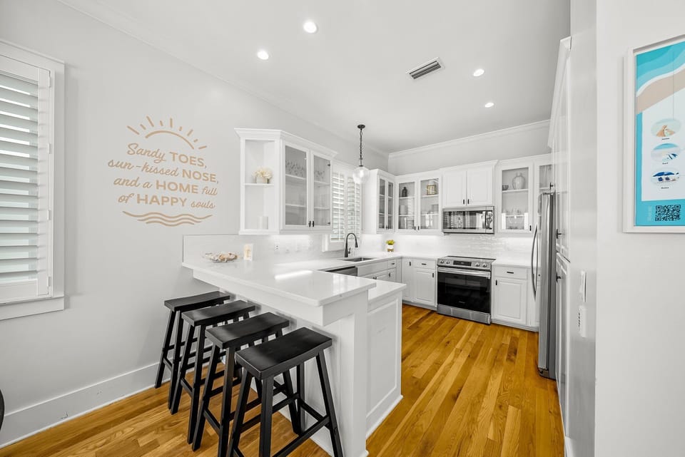 Remodeled Kitchen with granite countertops, stainless appliances - cook delicious meals and dine while overlooking the Gulf of Mexico!
