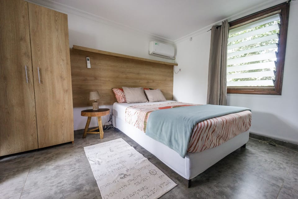 Your Queen-sized Bed awaits you. AC is hardly needed up here in the cool air.