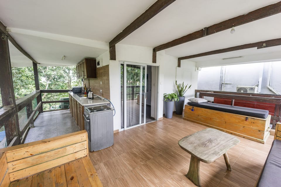 Outside kitchen with gas-cooker and oven, microwave, fridge, etc.