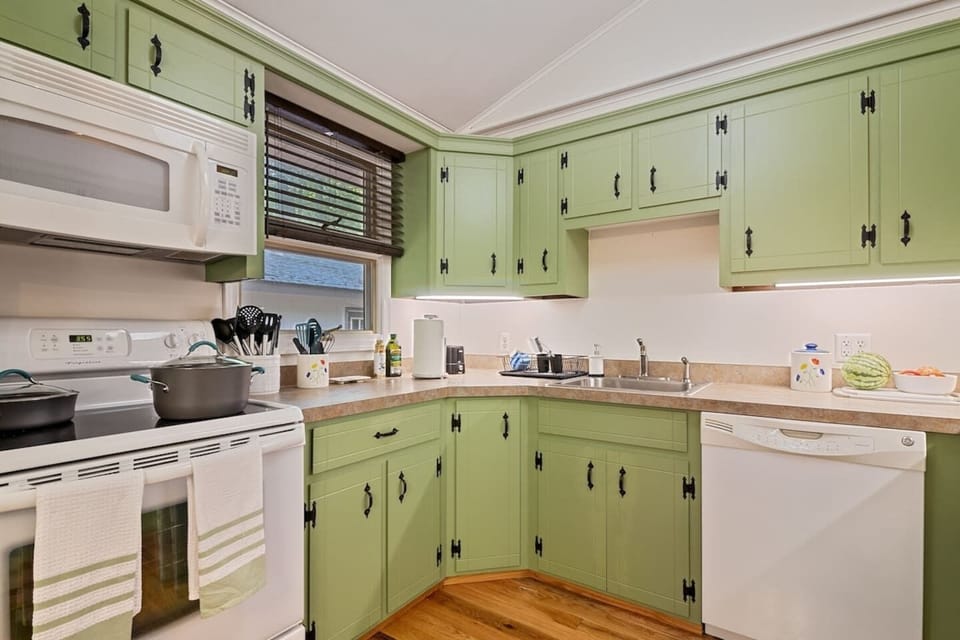 The clean and cheerful kitchen is stocked with all the pots, pans, cookware, serving dishes, and dishware you need to make cooking a breeze.  Spices, olive oil, and coffee will always be provided!