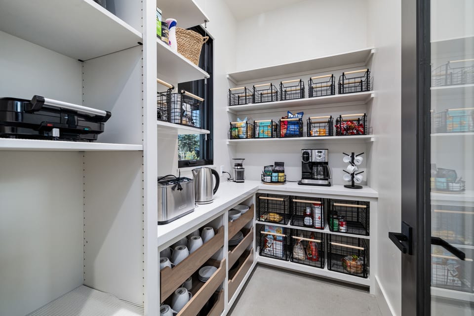 Generous pantry with various specialty small appliances