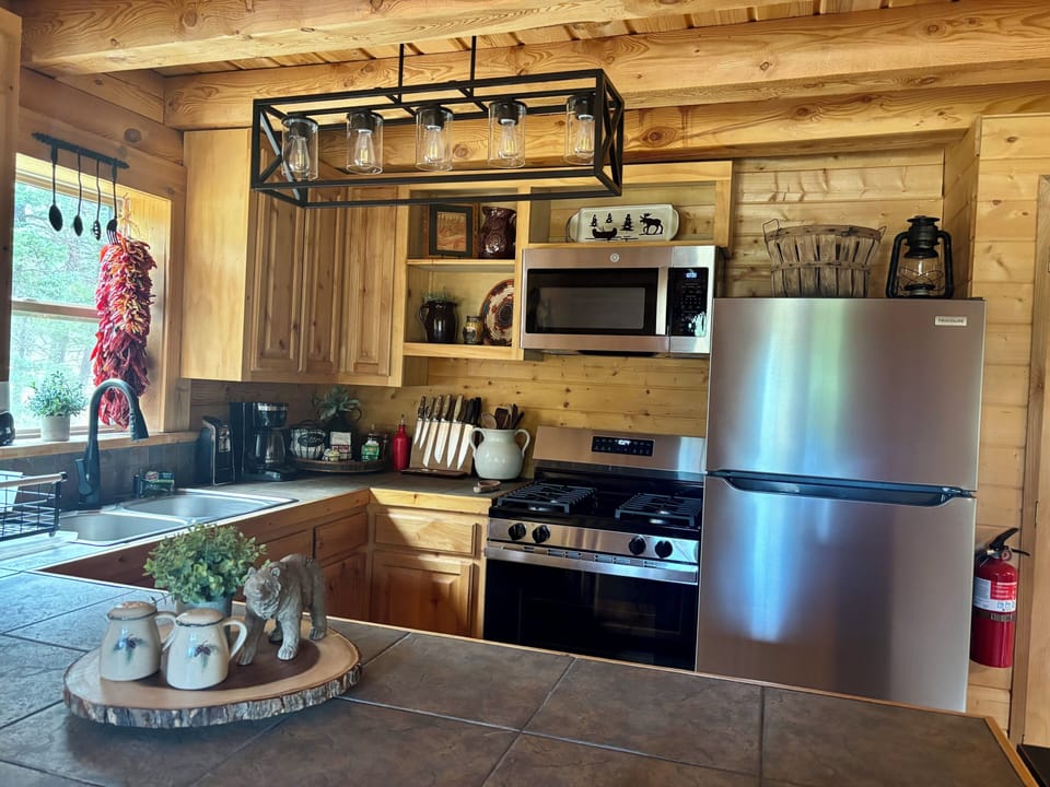 Updated kitchen with stainless steel appliances and a gas range