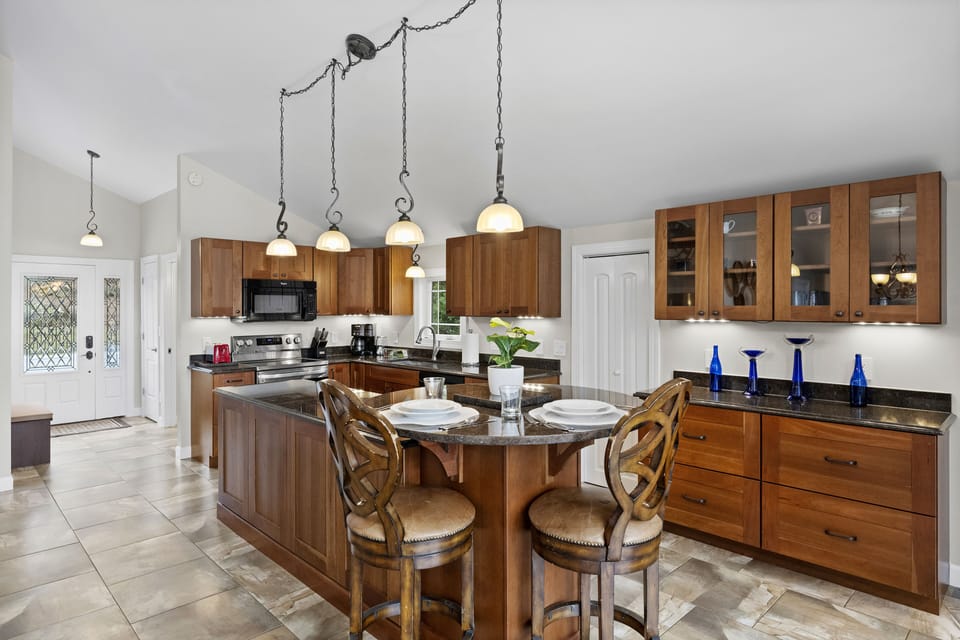 Large kitchen island with high chairs to match.
