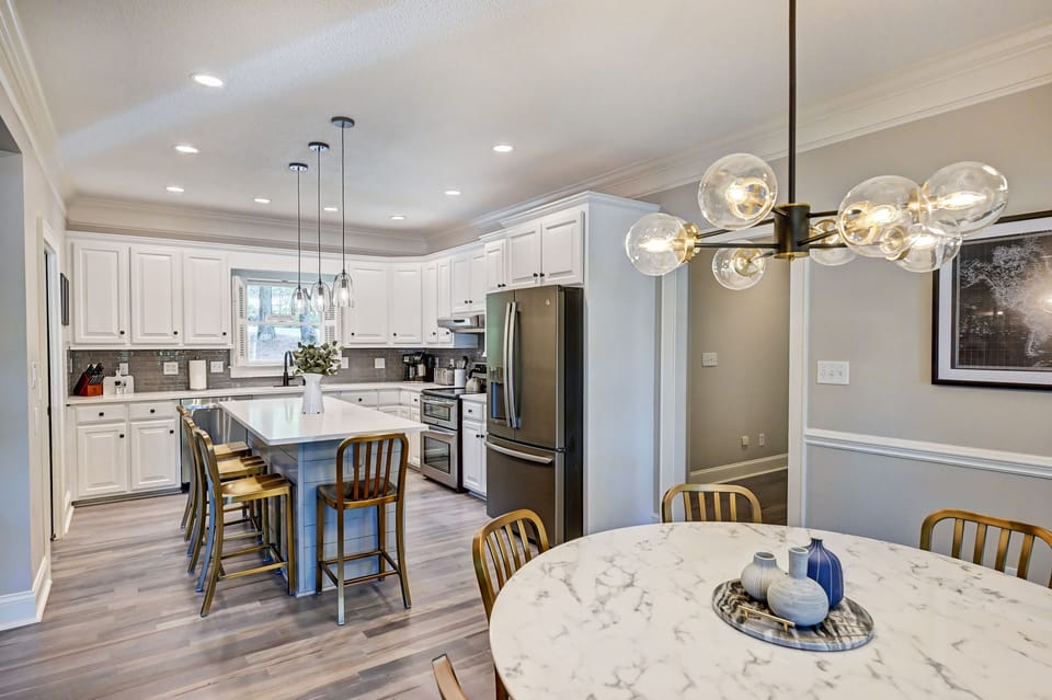 Eat in kitchen table with 6-top round table.
