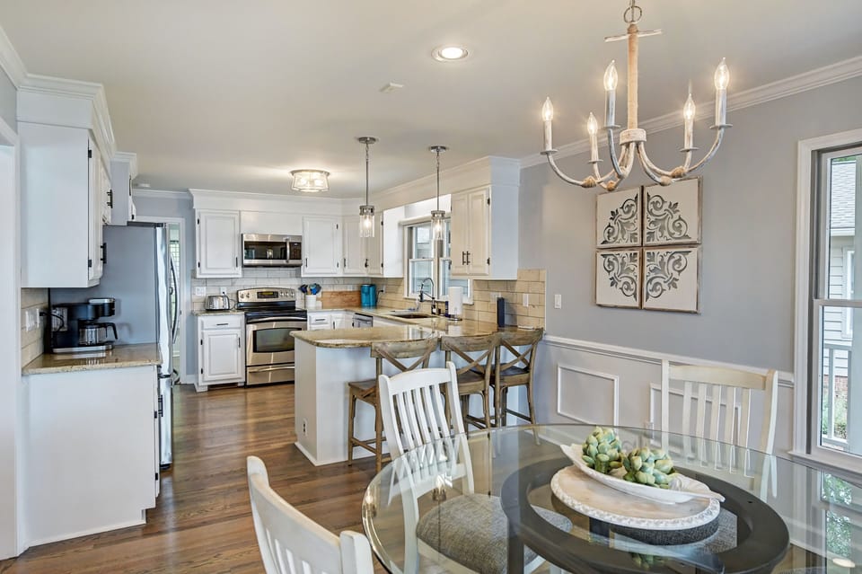 Kitchen and Dining Area - A dining table with seating for six and bar seating for three.