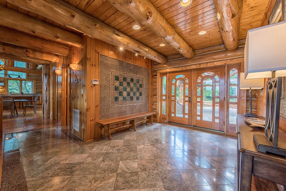 Gorgeous entryway, featuring Italian tile detail walls and floors.
