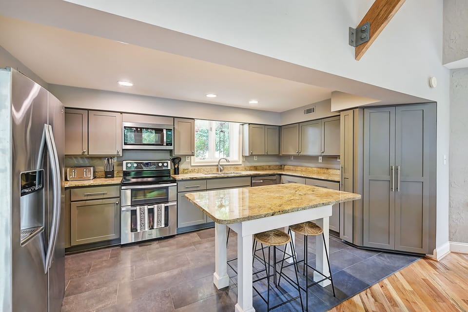 The kitchen offers ample counter space and stainless appliances.