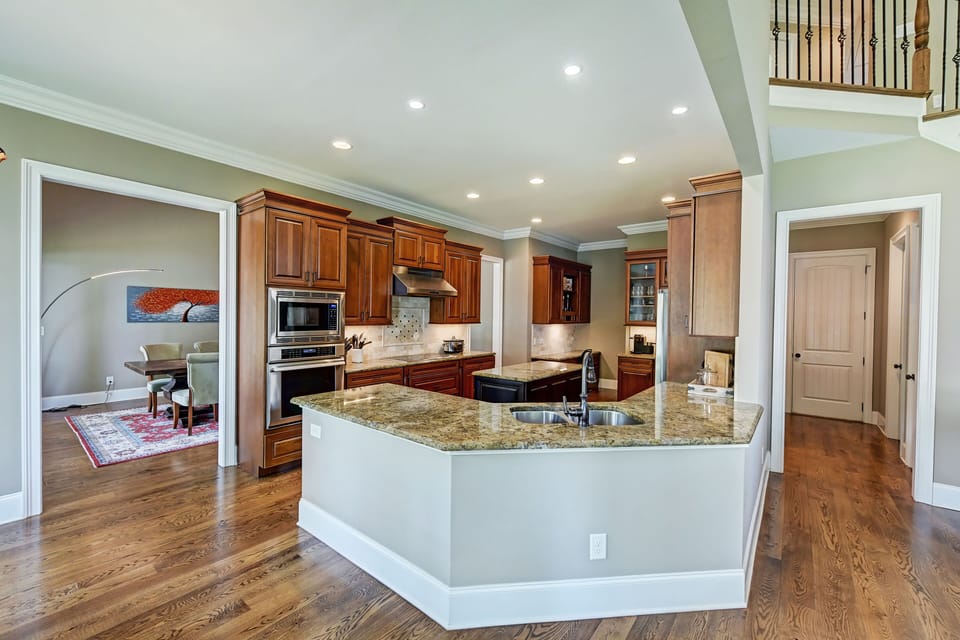 Modern kitchen with center island for chef's convenience.