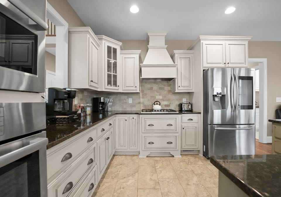 Lake Living I - Bright kitchen with bar seating.