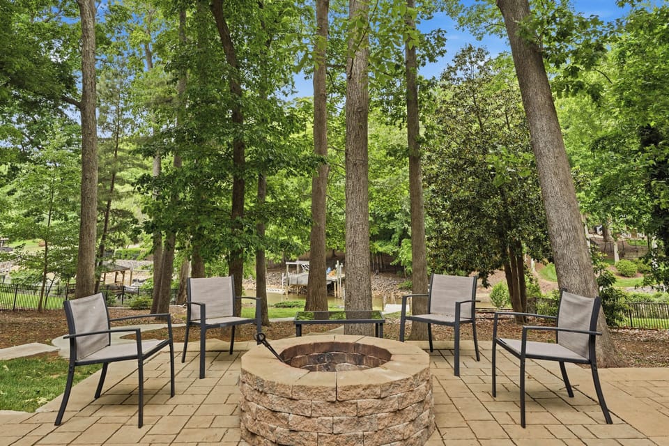 Fire pit patio with waterfront views, perfect for laid-back evenings outdoors.