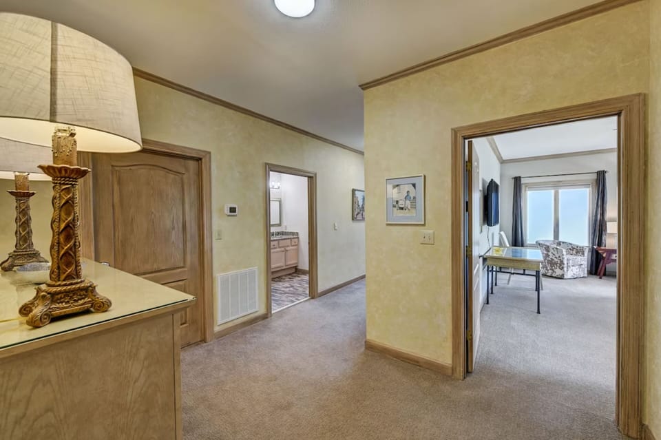 Private master hall to a full bathroom.