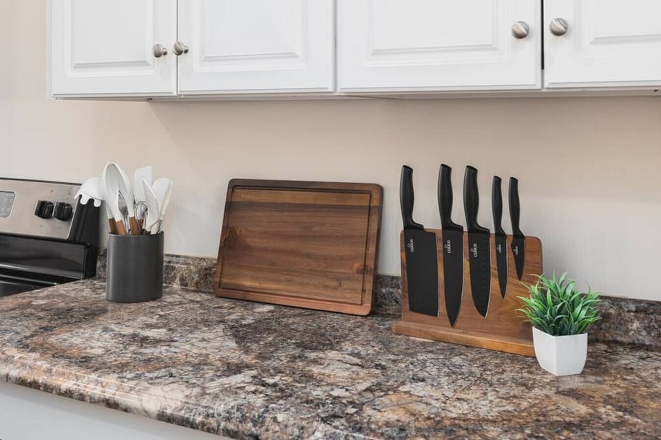 Fully-stocked kitchen with all the appliances & utensils you'd need to prepare a meal.