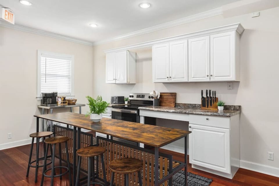 Fully-stocked kitchen with all the appliances & utensils you'd need to prepare a meal. Seating for four available at the counter.