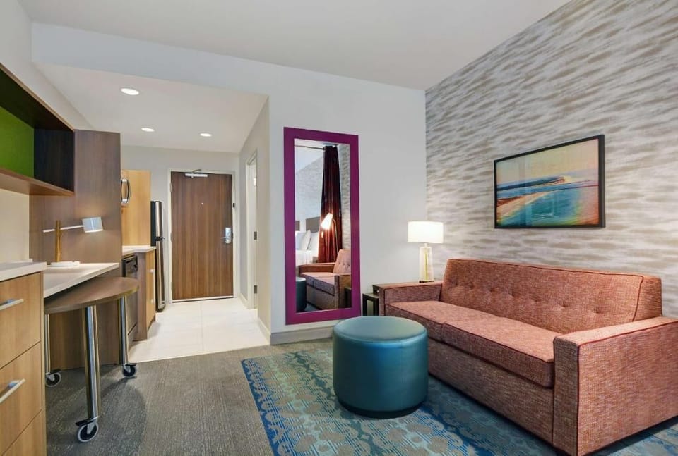 Kick back on the sofa with warm lighting and open space