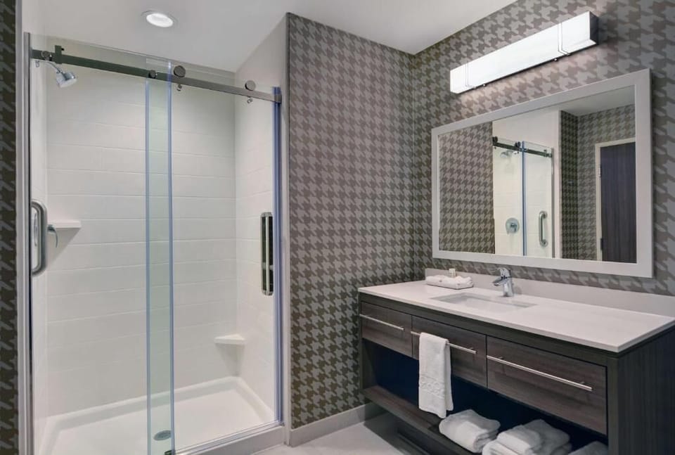 Refresh under a bright shower in a spotless, modern bath.