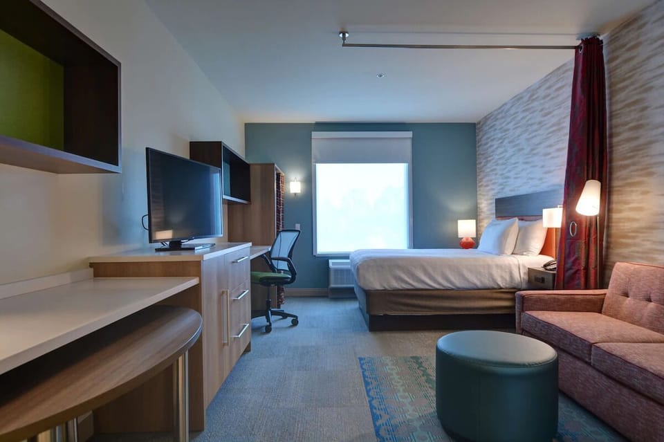 Work comfortably, then unwind in bed with entertainment nearby.