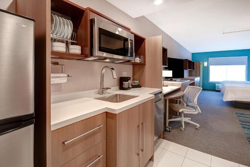 Prep quick meals with a roomy kitchenette and full-size fridge.